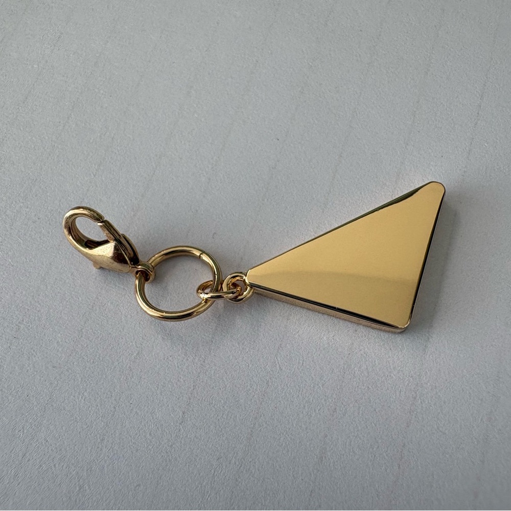 Prada Gold Triangle Logo Charm with Cream Enamel - Picture 4 of 9